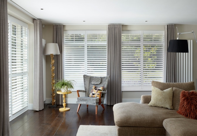 Our white shutter blinds in a lounge setting